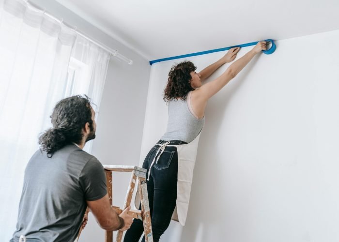 Reliable Handyman las vegas A couple collaborates to tape and paint a room during a home improvement project. Reliable Handyman las vegas
